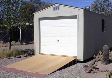 Gable shed with overhead door and ramp